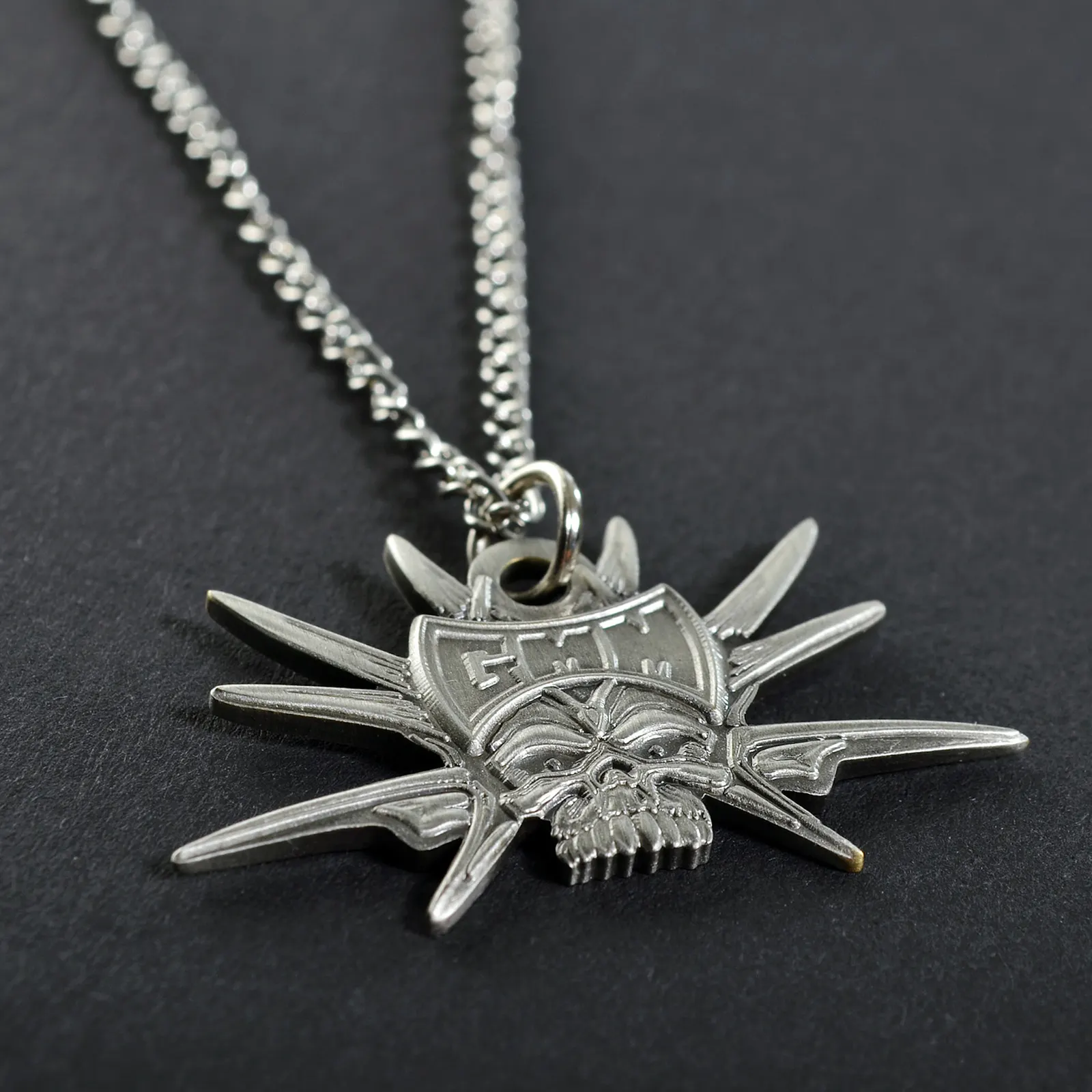 Metal necklace pendant in the shape of the Graspop skull