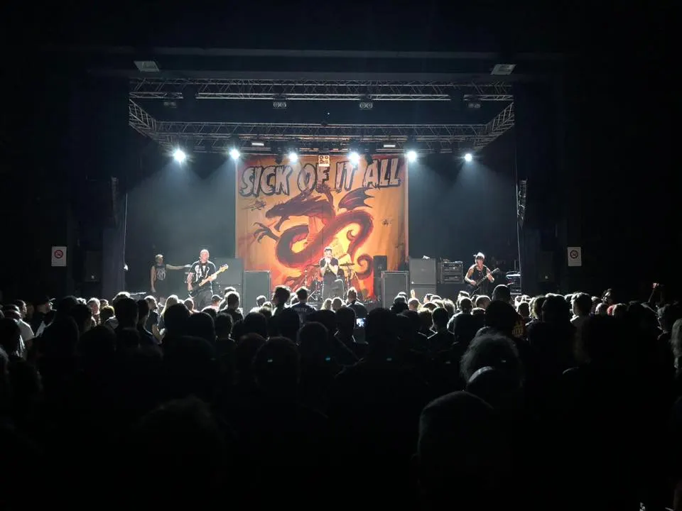 Sick of It All backdrop behind the band during a show